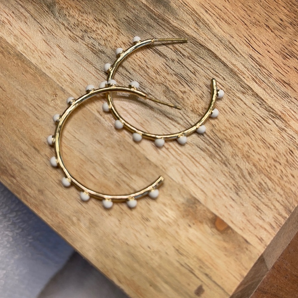 Gold and white hoop earrings